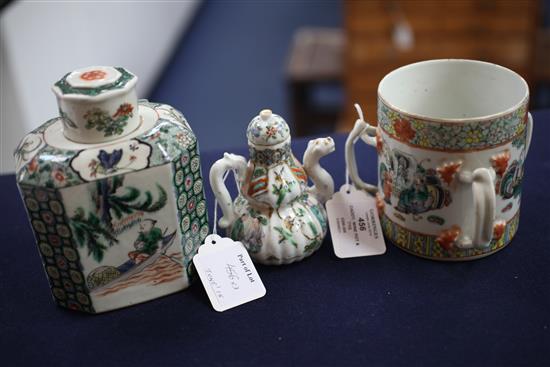 A Chinese enamelled porcelain tea caddy and cover, a wine pot and cover and a three handled tyg, 19th century, 11cm - 15cm